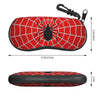 A red spider web patterned pouch with a black spider design and a metal clip.