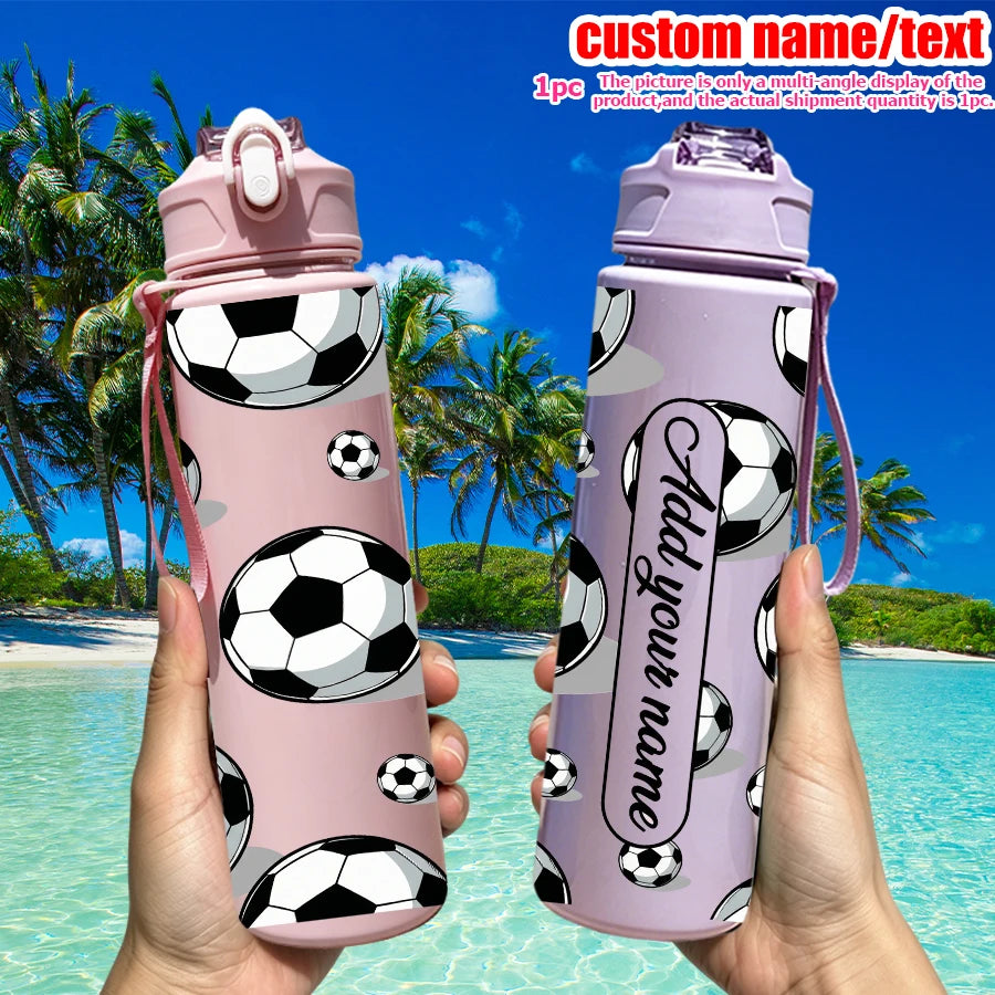 A pink football-themed water bottle with a lid is held against a tropical beach background.