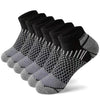 A stack of black and gray athletic knit ankle socks for men displayed on a white background.