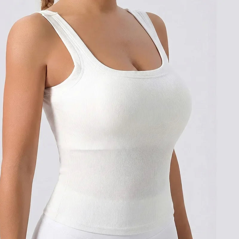 White racerback padded tank top worn by a model.