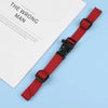 A red adjustable tactical backpack strap harness is shown against a light blue background.
