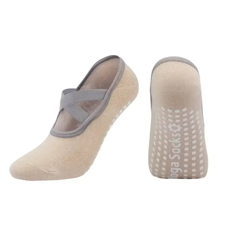 A pair of beige silicone anti-slip pilates and yoga socks shown from the side.