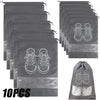 Ten reusable non-woven shoe storage bags in gray showing various styles of shoes.