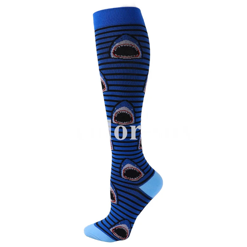 A navy blue compression sock with a repeating pattern of stylized teeth or fangs.
