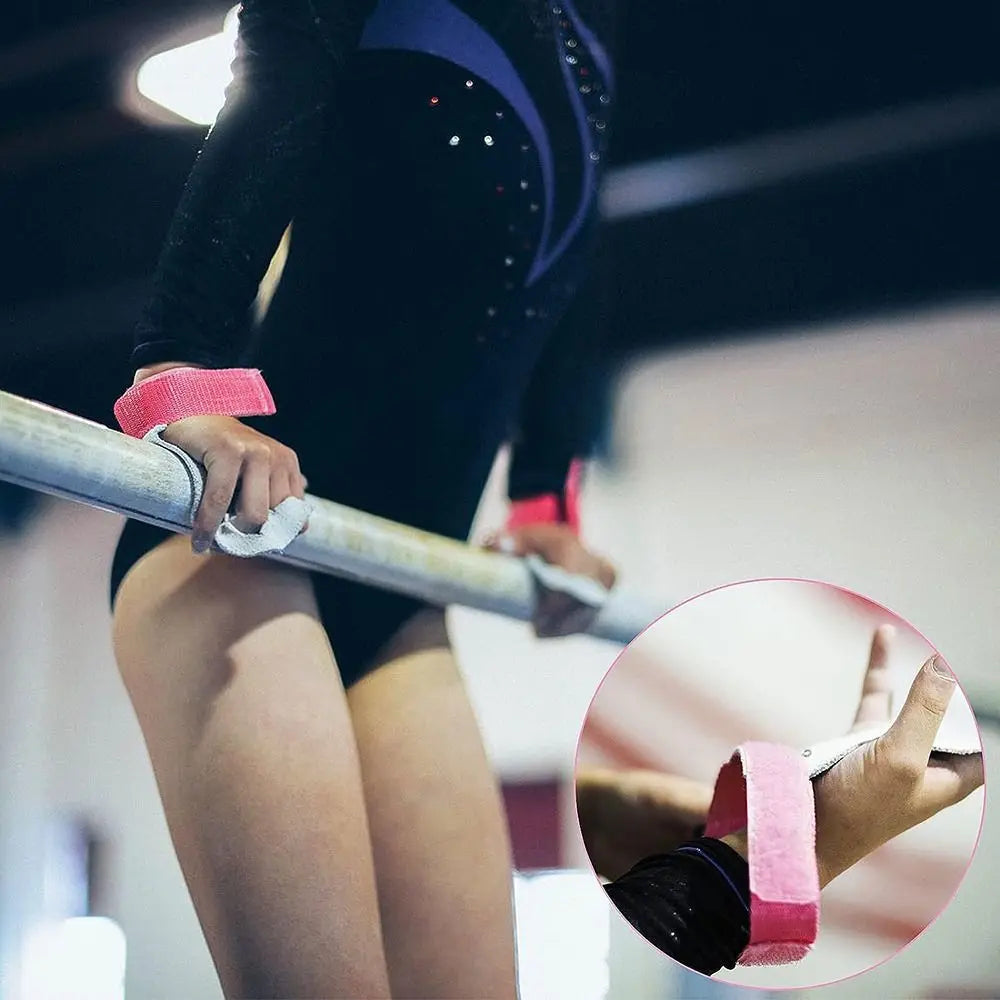 Close-up of a hand wearing a pink gymnastics wristband grip on a horizontal bar.