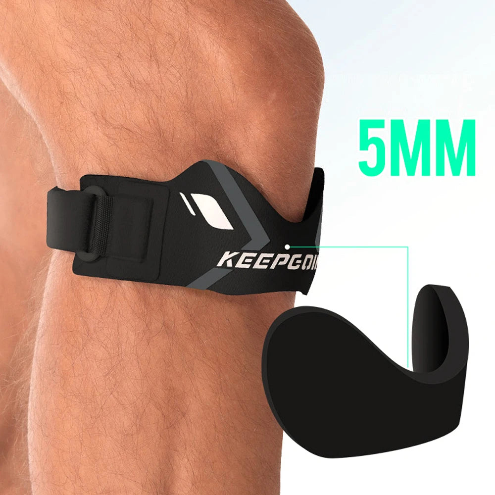 Black knee strap for pain relief and stabilization shown on a person's leg.