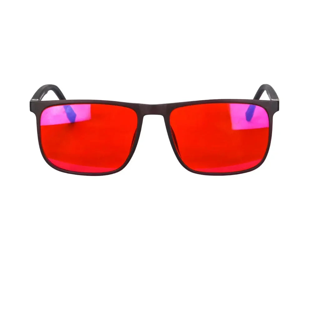 A pair of blue light blocking glasses with bright red lenses.