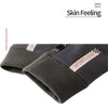 Dark gray velvet gloves with a subtle logo detail shown in a close-up view.
