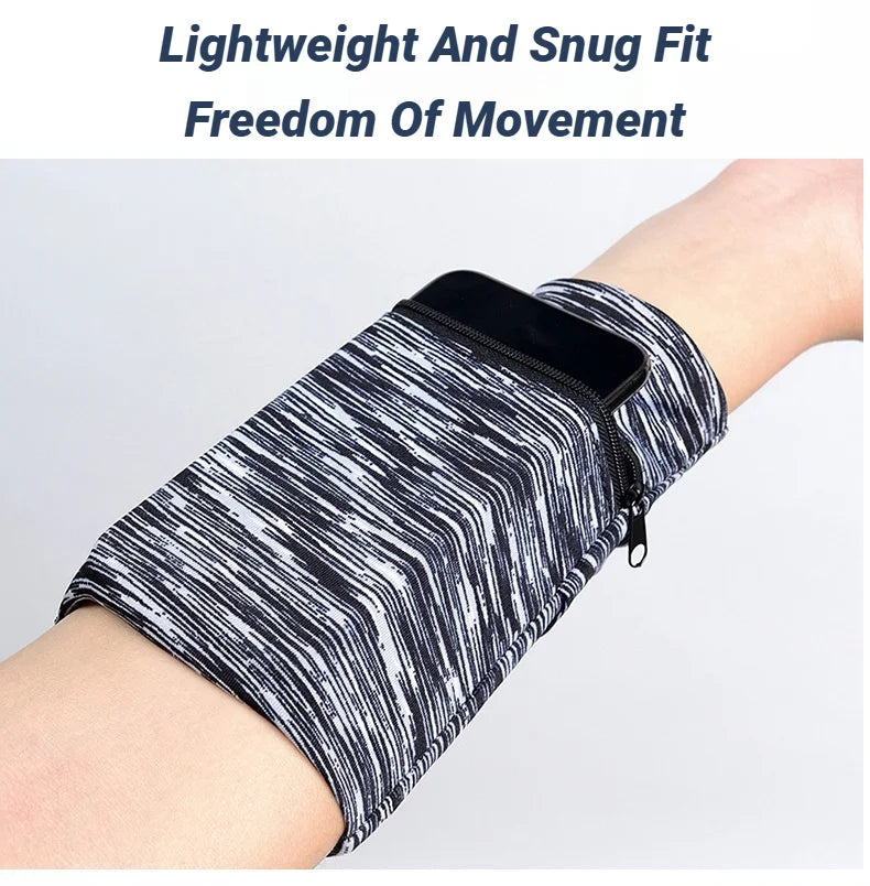 A close-up of a black and white striped, lightweight fabric wrist bag with a zipper on a person's arm.