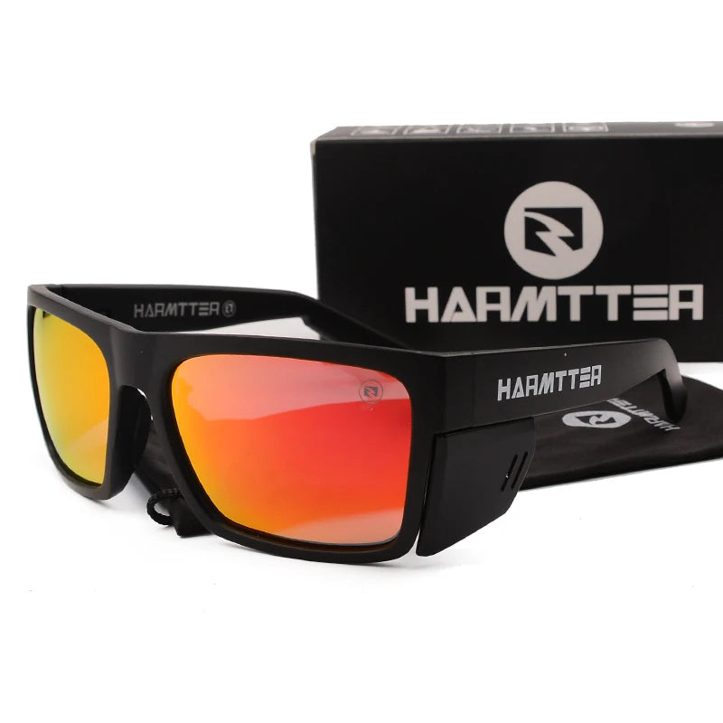 A pair of black Harmtter polarized sports sunglasses with orange-tinted lenses displayed next to their packaging box.
