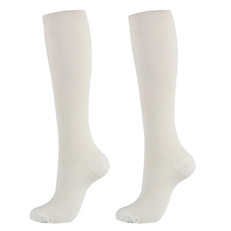 Pair of white medical grade compression socks for veins and circulation