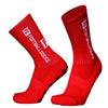 A pair of red football socks with silicone grip for anti-slip performance.