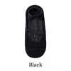 Black yoga socks with a crisscross strap design