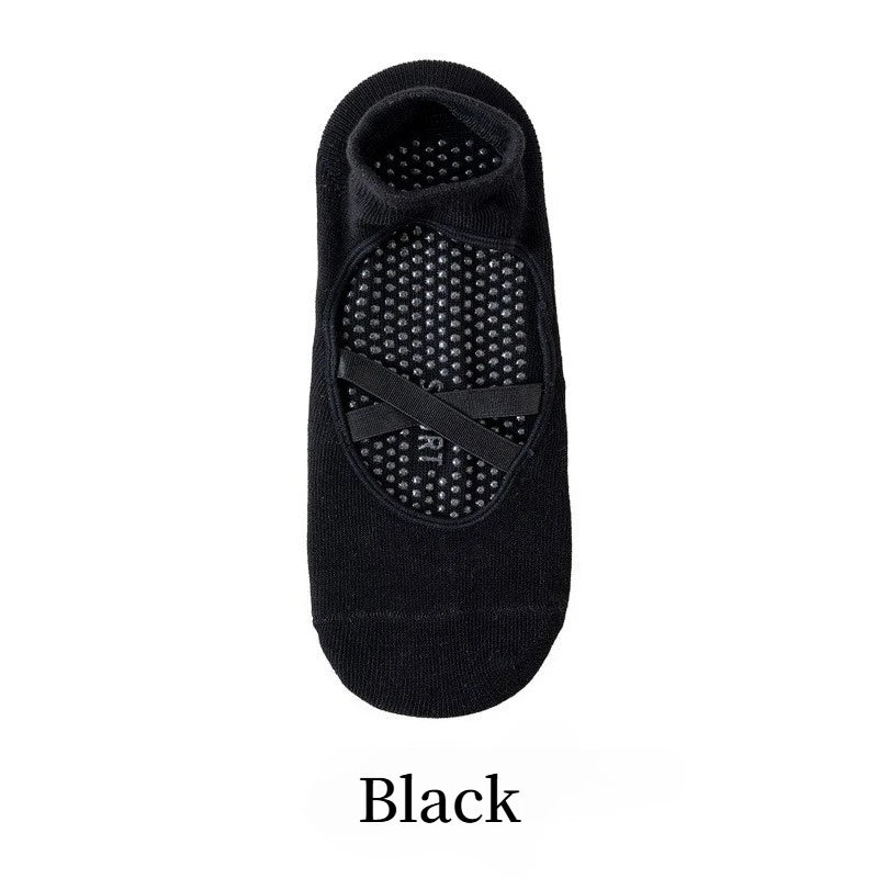 Black yoga socks with a crisscross strap design