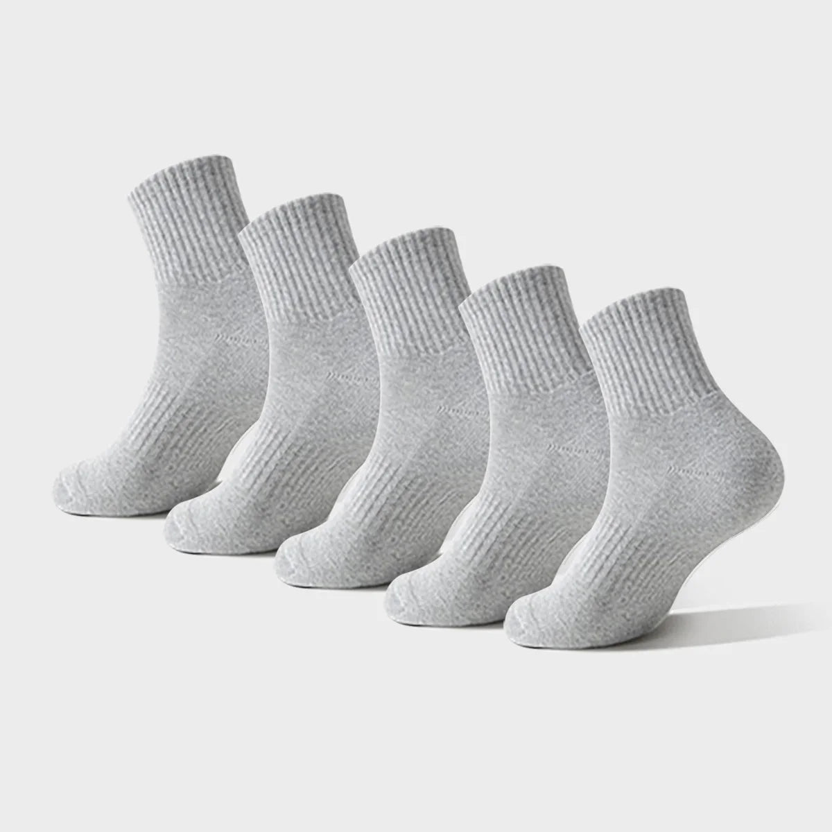 A stack of light gray premium athletic crew socks for men and women
