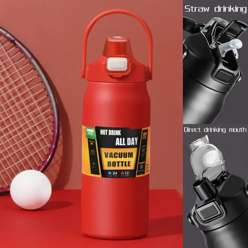A red insulated stainless steel water bottle with a straw drinking mechanism shown next to a tennis racket and a tennis ball.