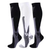 A set of three compression socks in black and white with gray accents for athletes and medical use