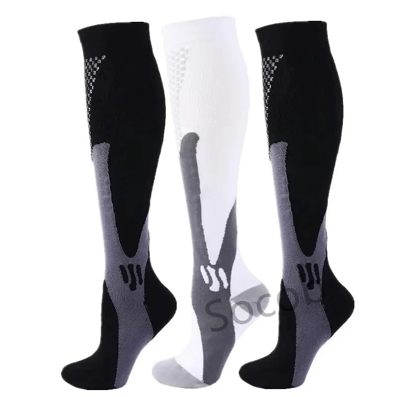 A set of three compression socks in black and white with gray accents for athletes and medical use