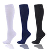 Three pairs of compression socks in white, navy blue, and black displayed vertically.