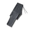 Gray men's ice silk performance pants laid flat with drawstring visible