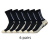 Sechs Paar schwarze Sportsocken mit weißem Zierrand und Absatzgriffen für Anti-Rutsch