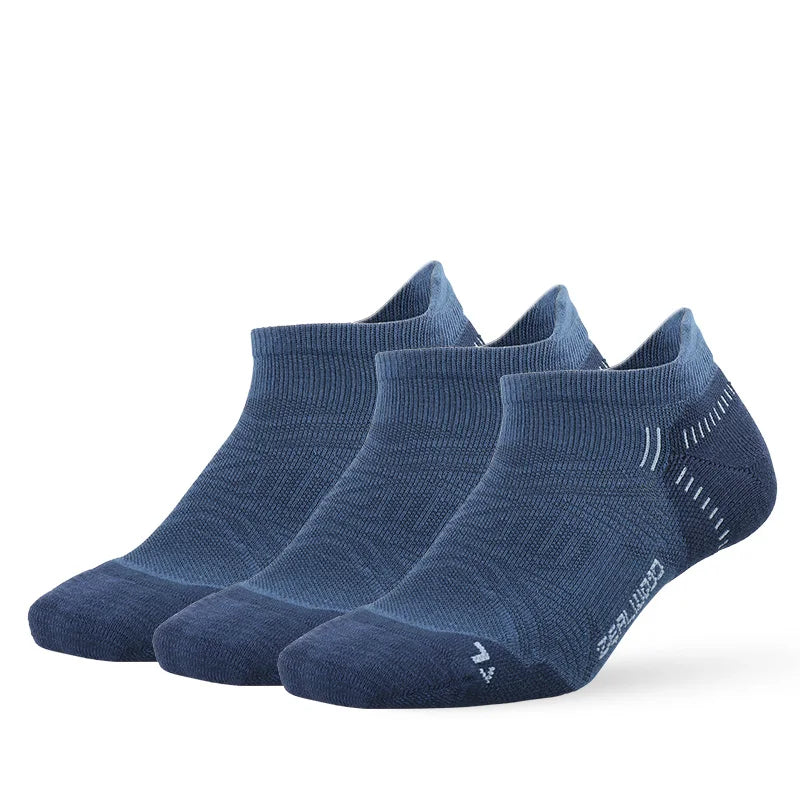 A pair of navy blue breathable performance running socks lying flat.