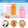 A set of clear and colored leakproof shaker bottles, including a white bottle, an orange bottle, and a pink bottle, next to s