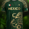 A dark green soccer jersey featuring an Aztec calendar style design and a large eagle graphic.