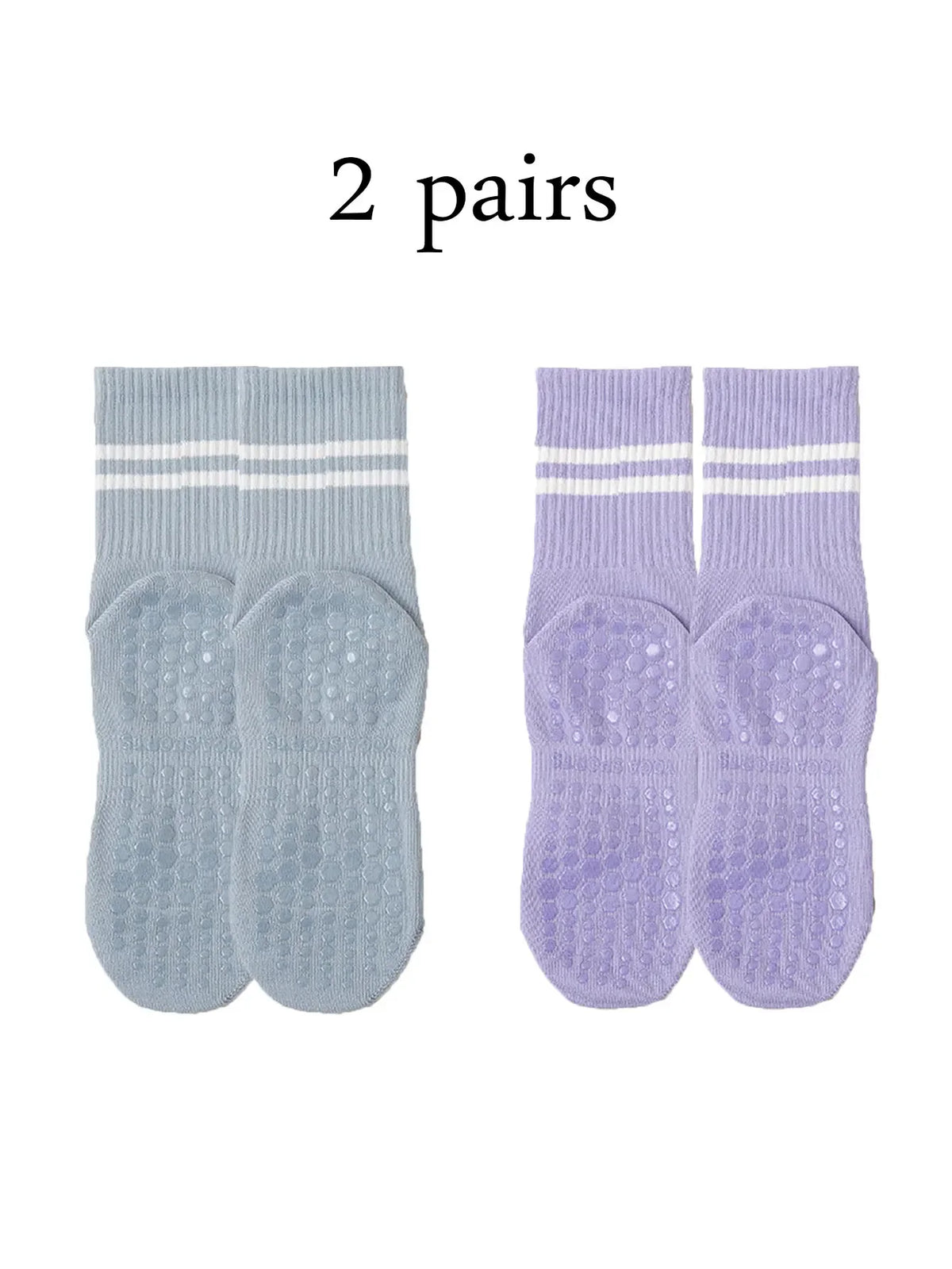 Two pairs of light blue and purple grip socks for yoga and barre