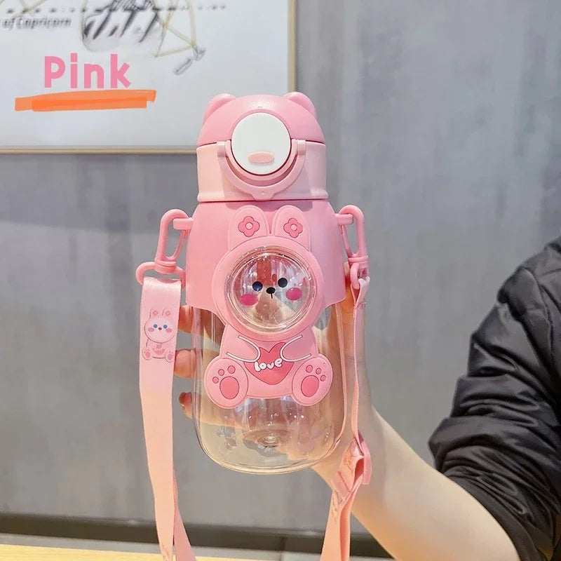 A pink leak-proof water bottle shaped like a cartoon animal, held by a strap.