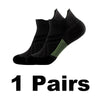 A pair of black performance compression sports socks shown from the side.