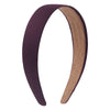 A pair of solid satin hair bands in purple and tan colors shown against a white background.