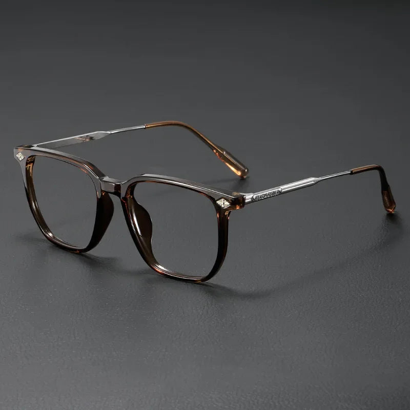 A pair of retro brown-tinted anti-blue light glasses resting on a dark surface.