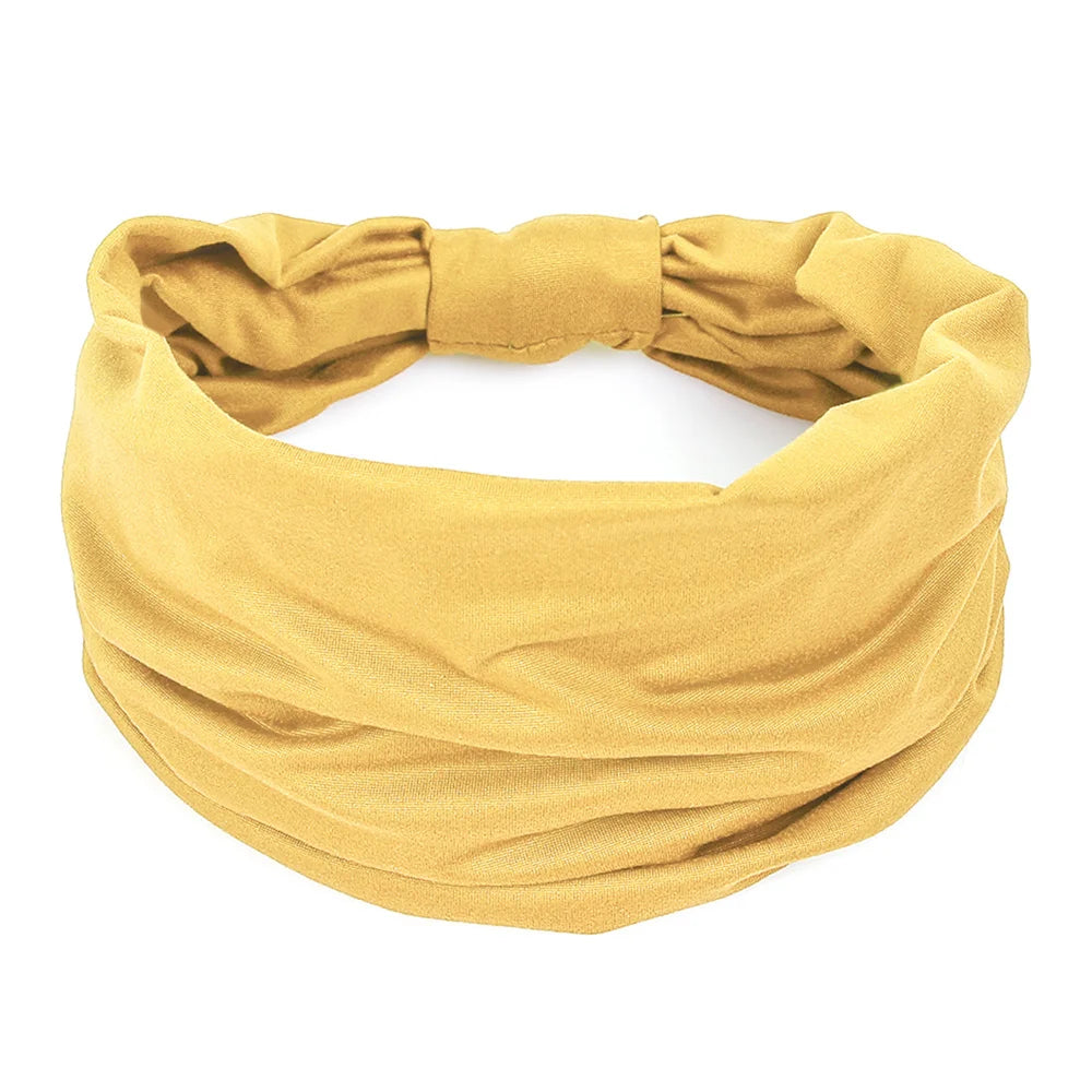 A mustard yellow non-slip elastic headband for fitness or hair