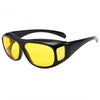 A pair of black night vision driving sunglasses with bright yellow lenses.
