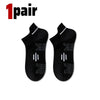 A pair of black premium breathable men's running socks shown flat.