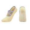 A pair of yellow silicone anti-slip pilates and yoga socks shown from the side.