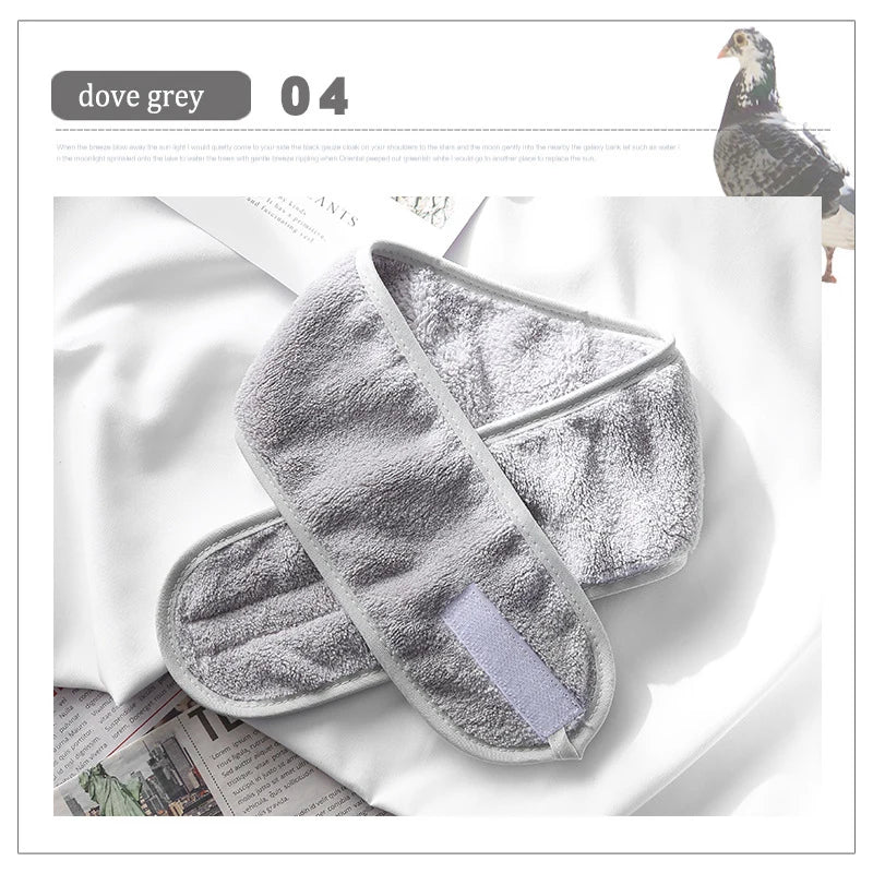 A dove grey faux fur and acrylic hair accessory is displayed on a white background.