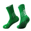 A pair of green athletic sports socks with white chevron patterns.