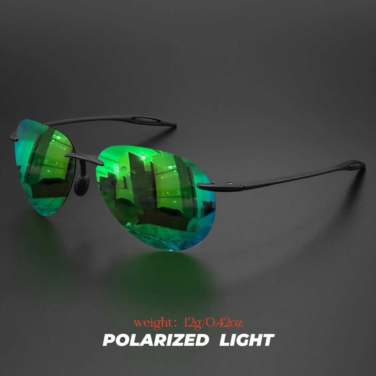 A pair of green polarized light aviator sunglasses resting on a dark surface.