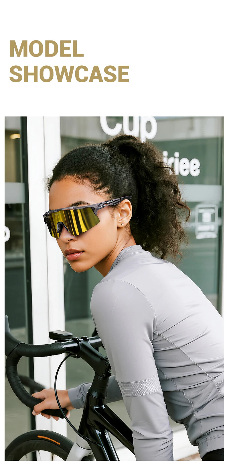 A woman wearing polarized performance sunglasses while riding a bicycle.
