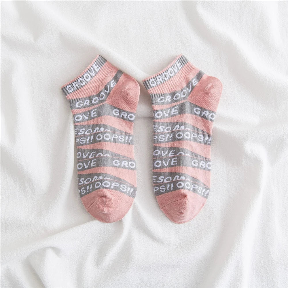 Pair of pink and gray striped socks with 'love' and 'oops' lettering for summer fashion