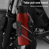 A red cup holder is shown mounted on a black bicycle frame, demonstrating a one-handed operation for convenient cycling.