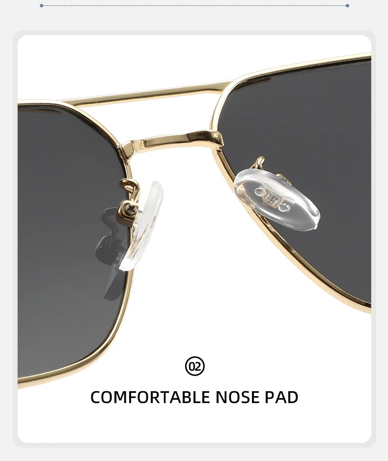 A close-up view of gold-framed sunglasses with clear nose pads and dark lenses.