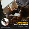 A person is shown using a copper fiber wrist protector for pain relief while reading.