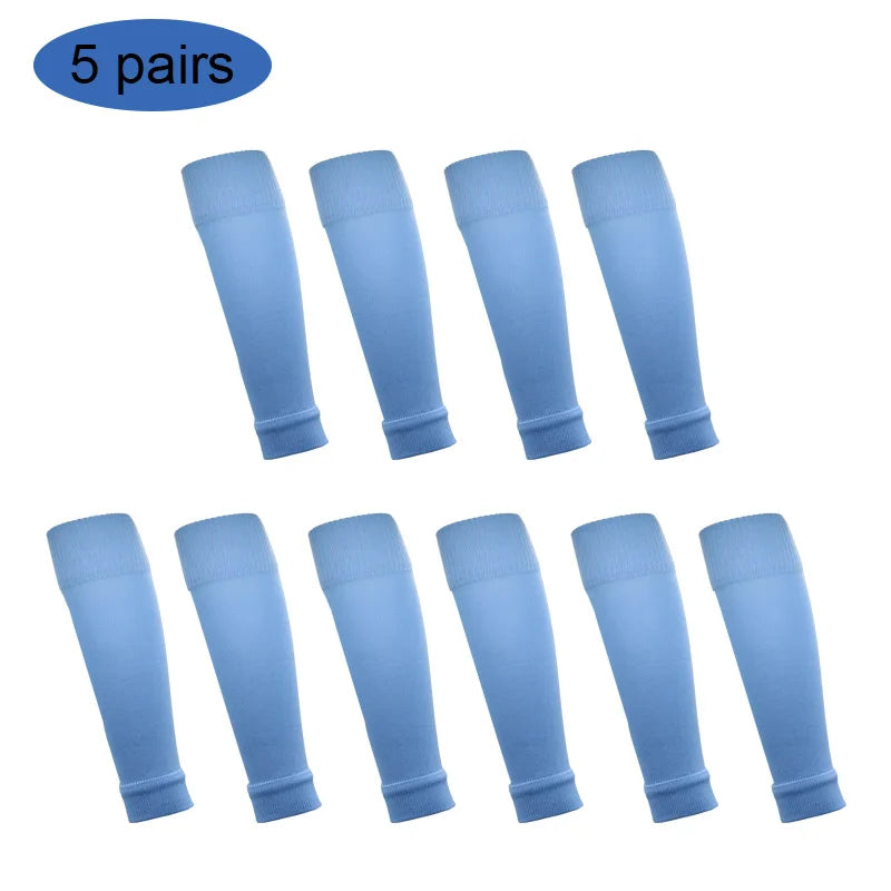 Five pairs of light blue football shin guards for leg protection