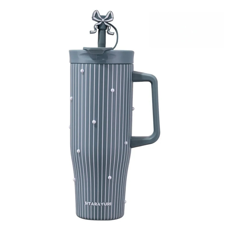 A tall, striped gray insulated thermos mug with a decorative black lid and loop handle.