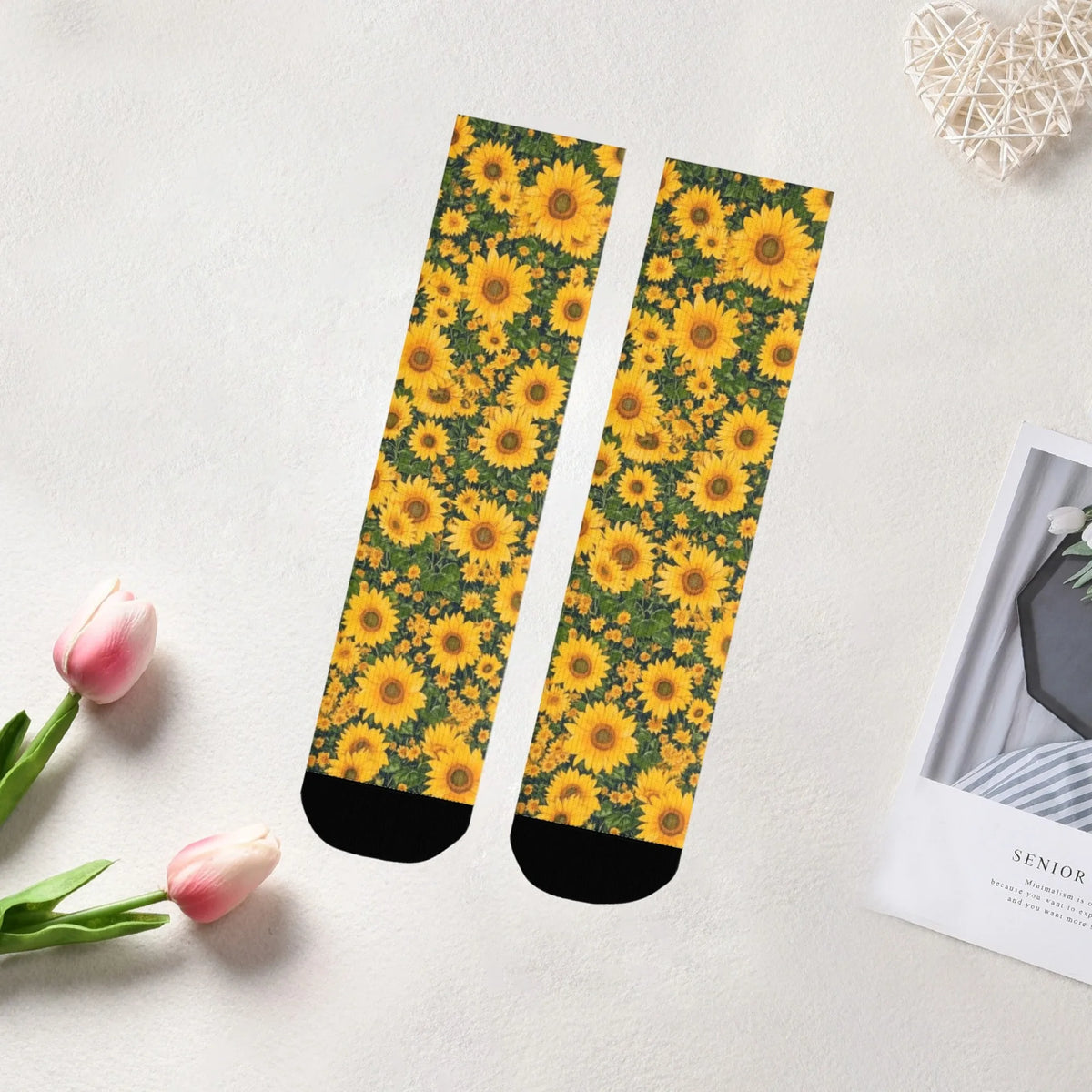 Pair of breathable crew socks featuring a vibrant yellow and green sunflower print.