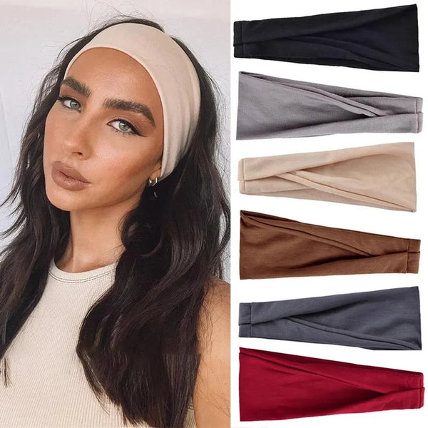 A woman models several elastic headbands in beige, gray, brown, and navy colors.