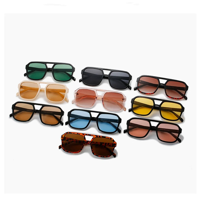 Una colección de gafas de sol cuadradas ligeras en tonos verde, negro, marrón y ámbar.